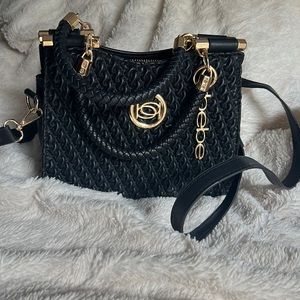 BEBE NWOT small clutch/crossbody purse with gold hardware.